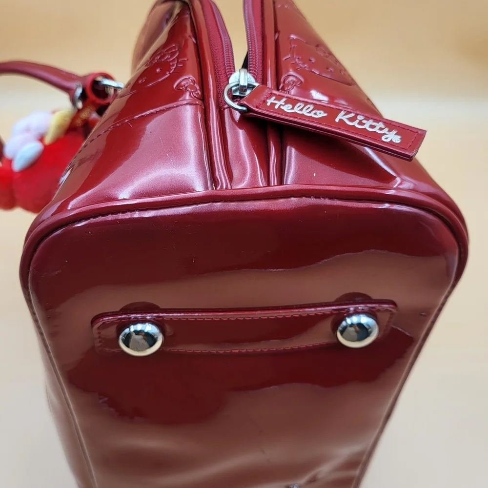 Hello Kitty Red Embossed Satchel with Character Charms..Original..GM size...